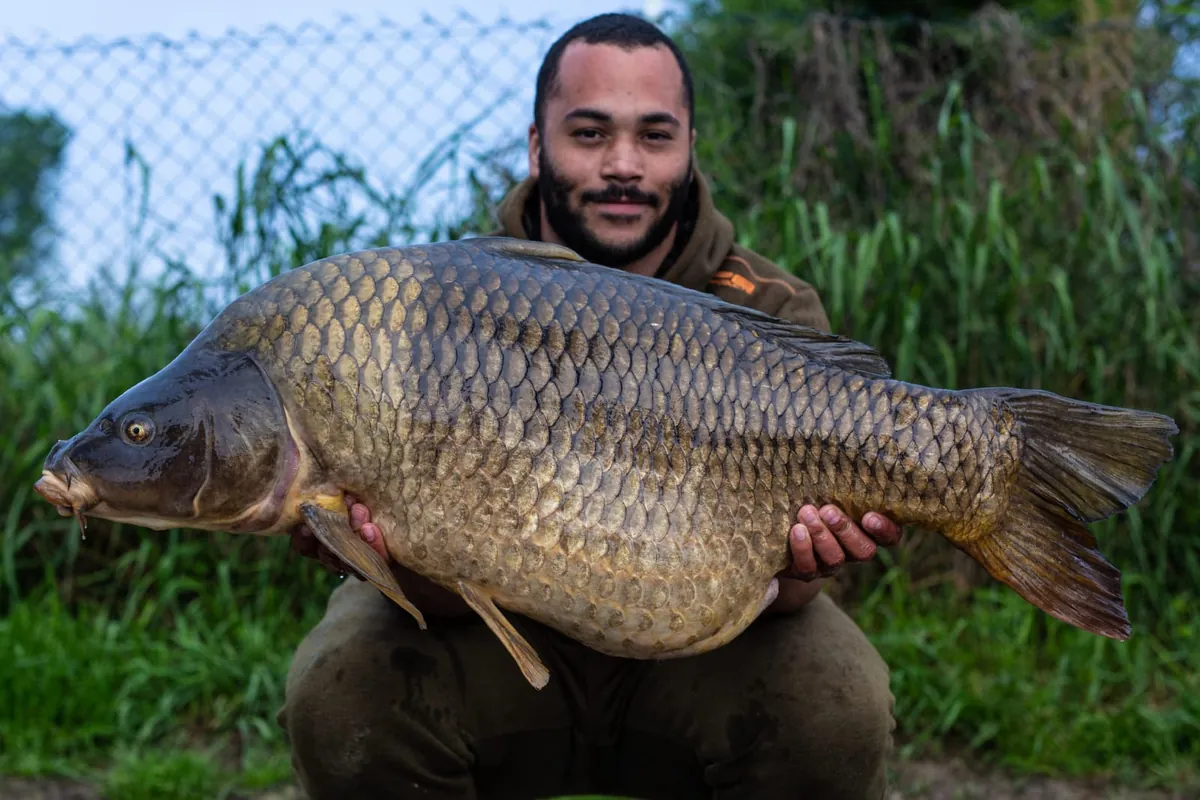 Jermaine holding a big common carp
